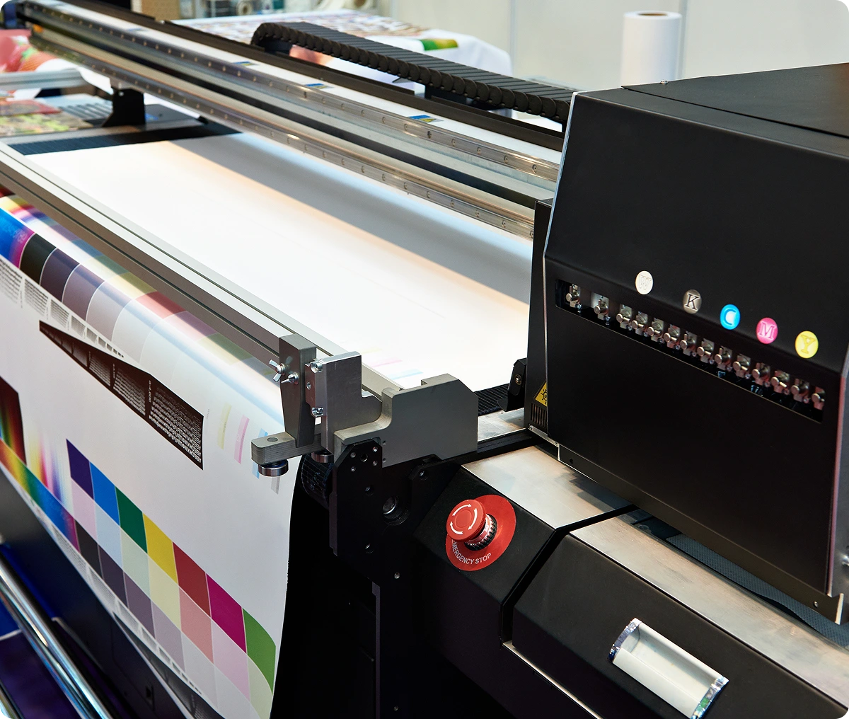 Large format printer producing colorful prints.