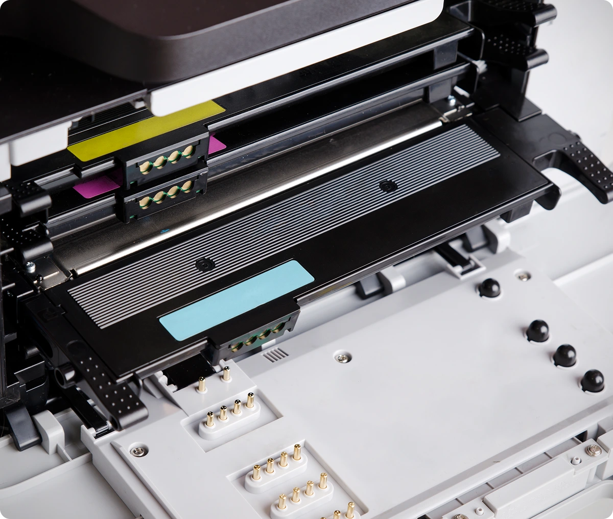 Open printer showing ink cartridges inside.