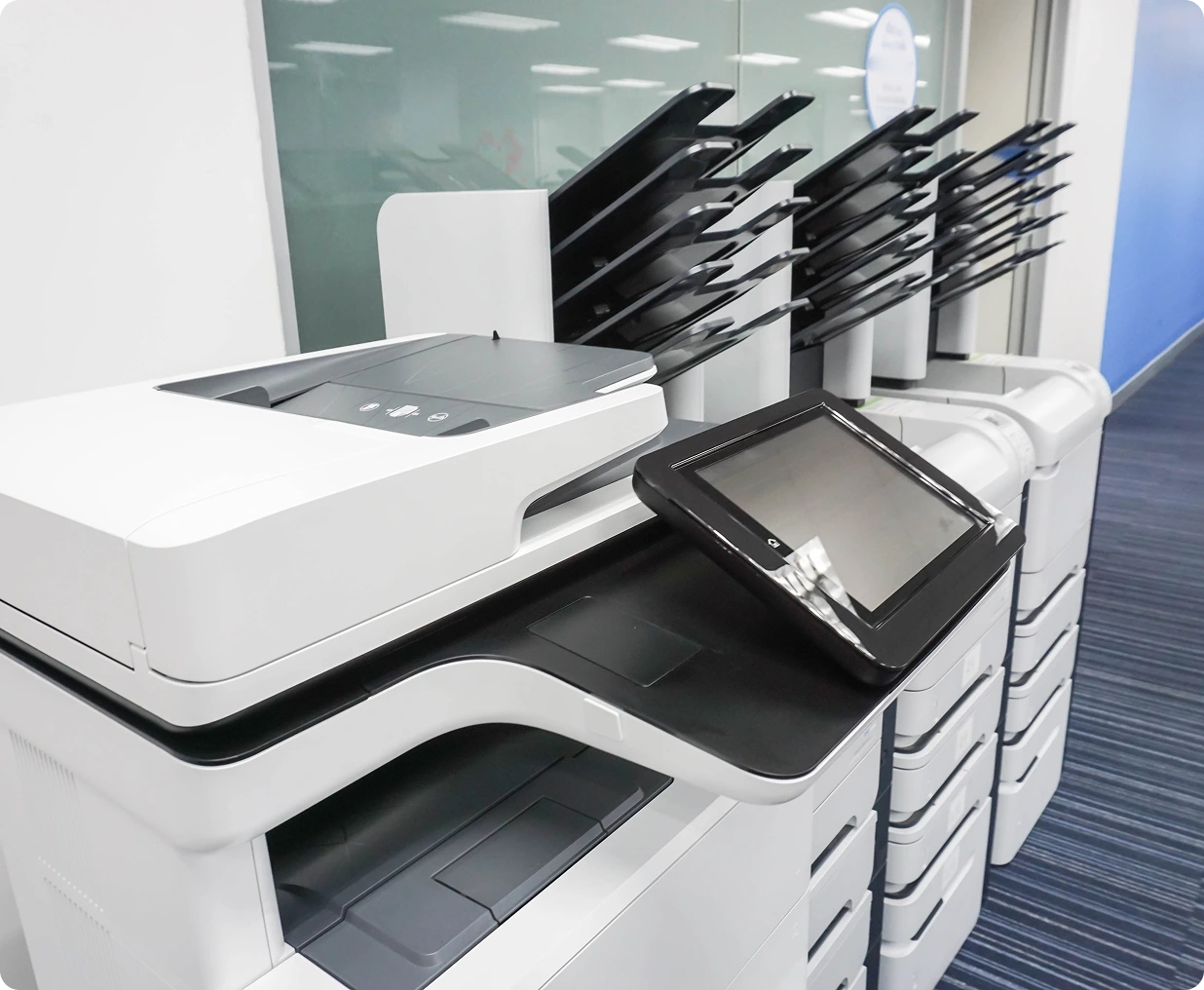Office multifunction printer with touchscreen interface.