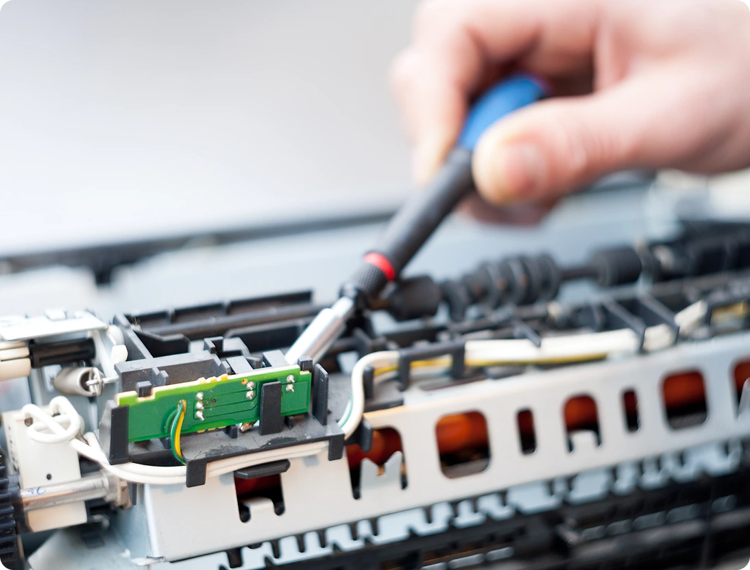 Repairing electronic device with a screwdriver.